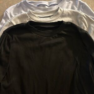 Black, Gray, and Light Blue Crewneck Shirts